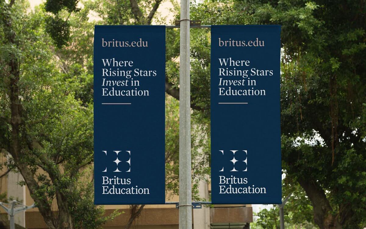 Britus education brand flags in garden sporting their IVIA award winning identity